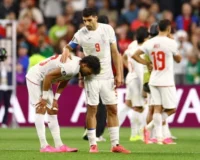 Iran's Ramin Rezaeian and Mehdi Taremi look dejected after the World Cup Group G game against Egypt in Seattle. Photograph: Carlos Barría/Reuters