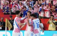 Croatia’s Ante Budimir (centre) celebrates his goal against Panama with Ivan Perisic and Martin Baturina. Photograph: Nathan Denette/The Canadian Press/AP