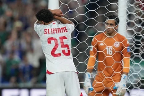 Tunisia’s Anis Slimane, left, reacts. Photograph: Dolores Ochoa/AP