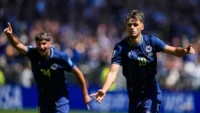 Image: Bosnia's Kerim Alajbegovic, right, celebrates after scoring his side's opening goal during the World Cup Group B soccer match against Qatar in Seattle, Wednesday, June 24, 2026. (AP Photo/Lindsey Wasson)