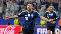 Image: Argentina's Lionel Messi celebrates scoring during the World Cup Group J match against Jordan in Dallas