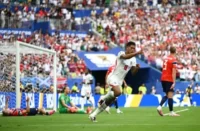 Jude Bellingham wheels away to celebrate his equaliser. Photograph: Hannah Peters/Fifa/Getty Images