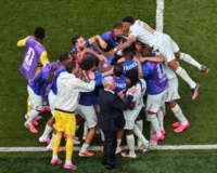 Nearly the entire France squad engulfed Ousmane Dembélé after he scored their second against Morocco. Photograph: Angela Weiss/AFP/Getty Images